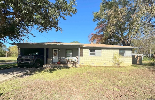 single story home with a front lawn and a carport