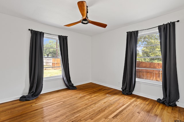 empty room featuring ceiling fan and light hardwood / wood-style flooring