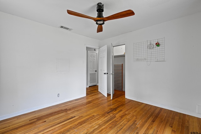 unfurnished bedroom with hardwood / wood-style floors and ceiling fan