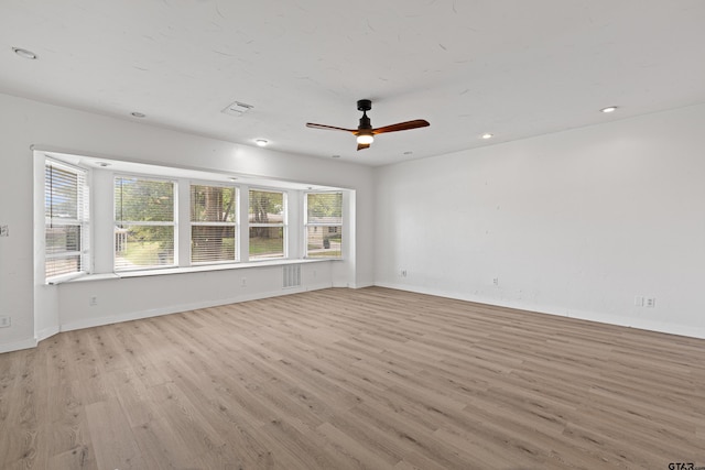 interior space featuring ceiling fan and light hardwood / wood-style flooring