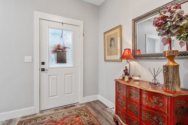 entryway with wood-type flooring