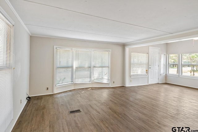 unfurnished room featuring ornamental molding