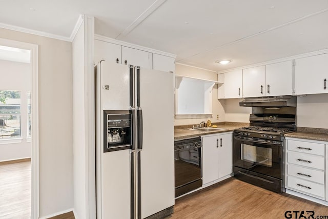 kitchen with black appliances, light wood-type flooring, white cabinetry, ornamental molding, and sink