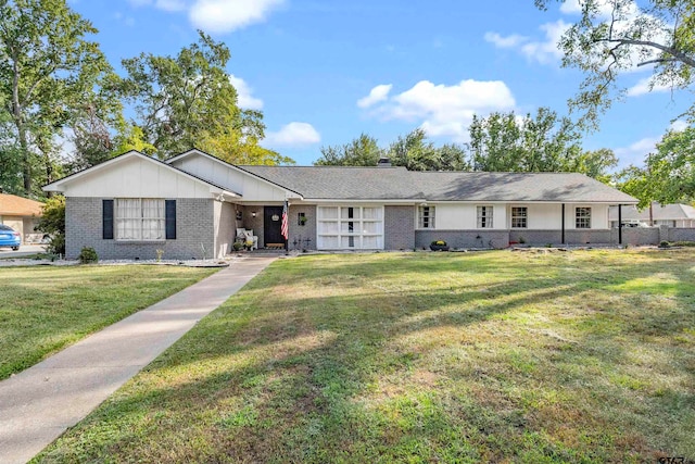 ranch-style home featuring a front yard