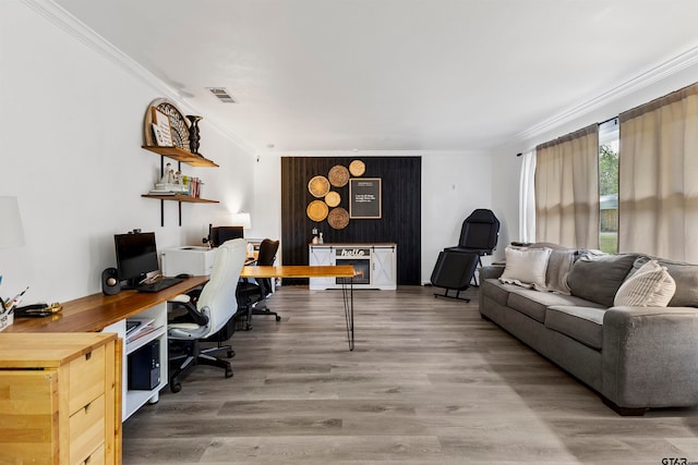 home office featuring hardwood / wood-style floors and crown molding