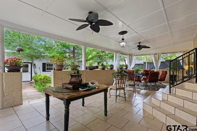 view of patio / terrace featuring ceiling fan, fence, and outdoor dining area