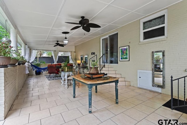view of patio / terrace with a ceiling fan and outdoor dining space