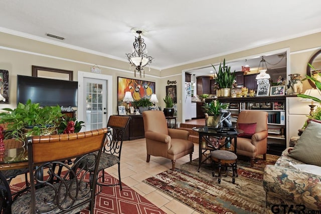 living area featuring visible vents, ornamental molding, and light tile patterned floors