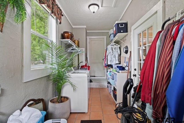 washroom featuring laundry area, french doors, independent washer and dryer, a textured ceiling, and a textured wall