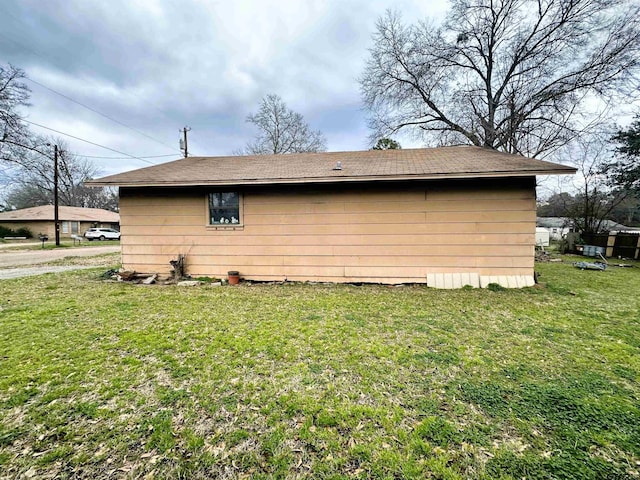 view of property exterior featuring a lawn