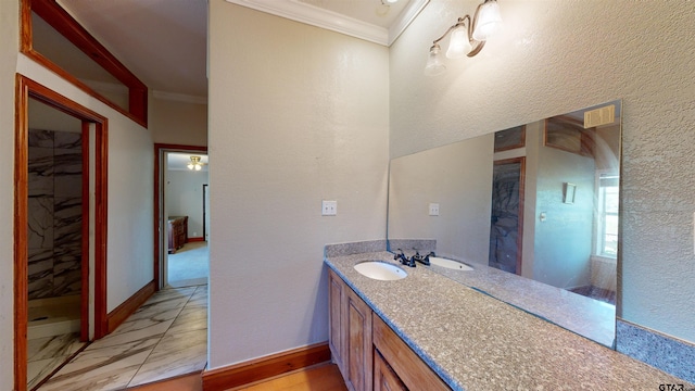 bathroom with vanity and crown molding