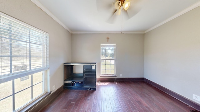 unfurnished living room with ceiling fan, dark hardwood / wood-style floors, and ornamental molding