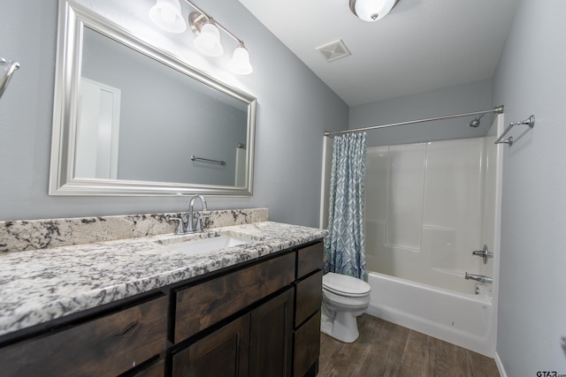 107 Oliver Wendell Ct, Mount Vernon, TX 75457 - bathroom featuring wood finished floors, toilet, vanity, and shower / tub combo