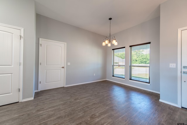 107 Oliver Wendell Ct, Mount Vernon, TX 75457 - spare room with dark wood finished floors, a chandelier, and baseboards