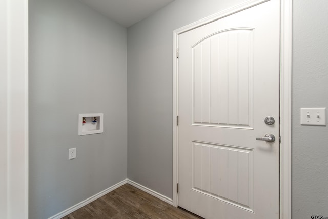 107 Oliver Wendell Ct, Mount Vernon, TX 75457 - laundry area with hookup for a washing machine, dark wood-style floors, and baseboards