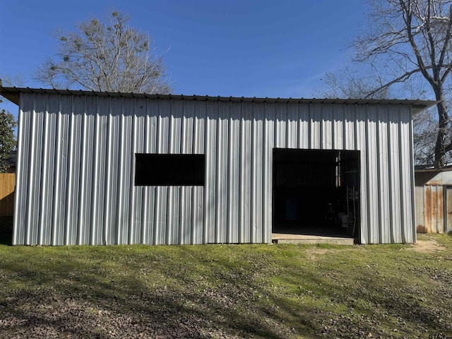 view of outdoor structure featuring a lawn