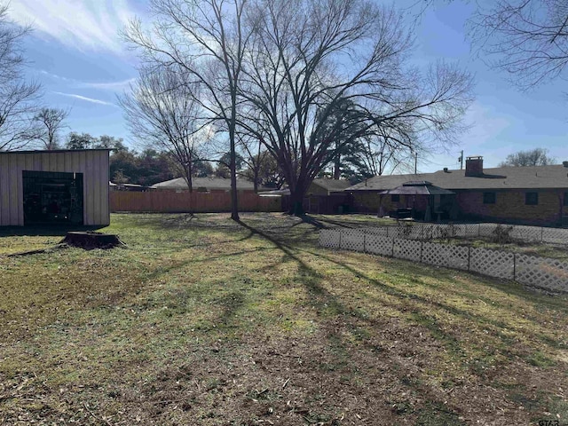 view of yard featuring a gazebo and a storage shed