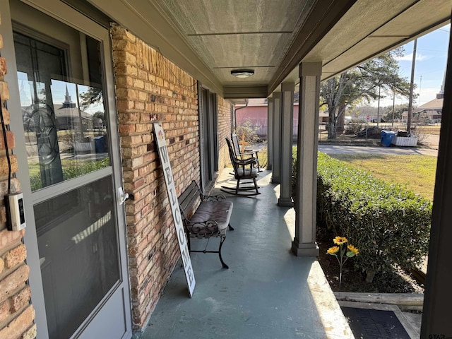 view of patio featuring a porch