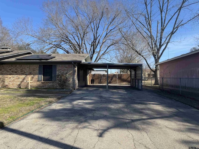 exterior space with a carport