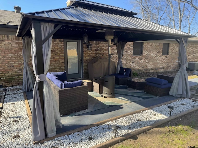 view of patio with area for grilling, cooling unit, and outdoor lounge area