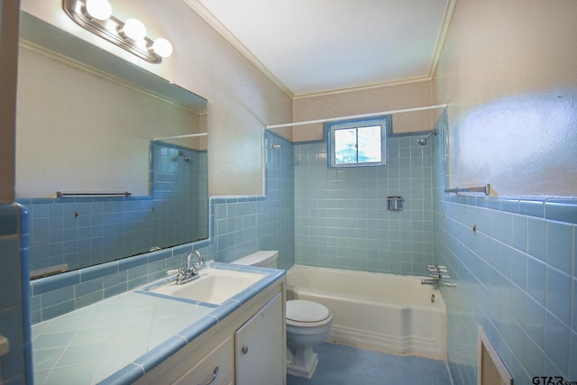 full bathroom with tile walls, tiled shower / bath combo, vanity, toilet, and crown molding