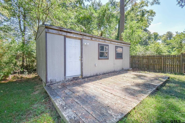 view of outbuilding with a yard