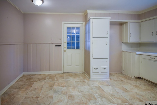 kitchen featuring crown molding and white cabinets