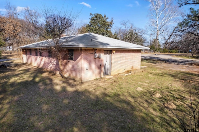 view of home's exterior with a lawn