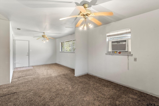 spare room with ceiling fan, cooling unit, and carpet