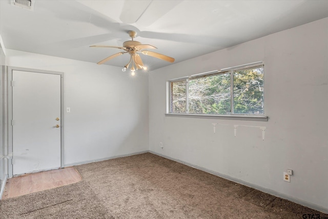 unfurnished room with ceiling fan and carpet floors