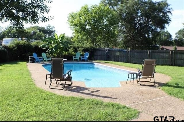 view of pool with a lawn, a fenced in pool, and a fenced backyard