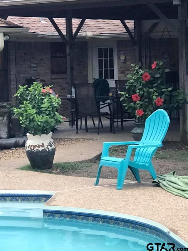 view of patio / terrace featuring a lanai and an outdoor pool