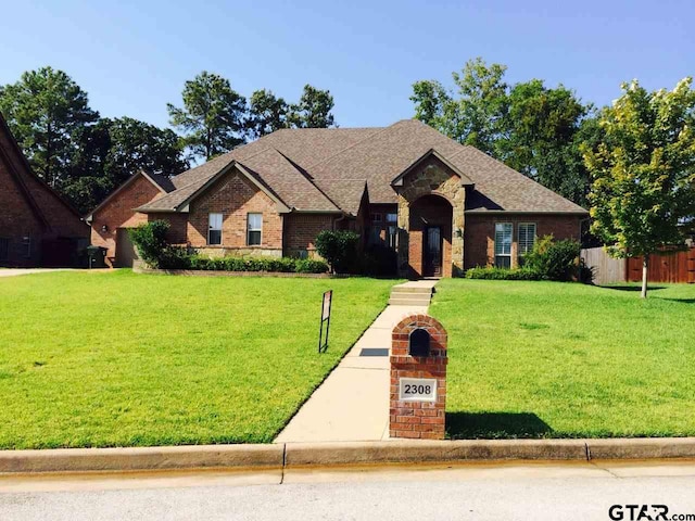 2308 Pinehurst St, Tyler, TX 75703 - view of front of property featuring brick siding and roof with shingles