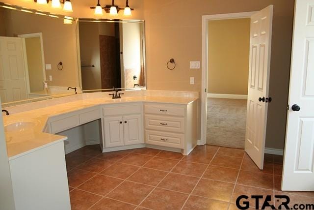 2308 Pinehurst St, Tyler, TX 75703 - full bath featuring tile patterned floors, double vanity, and baseboards