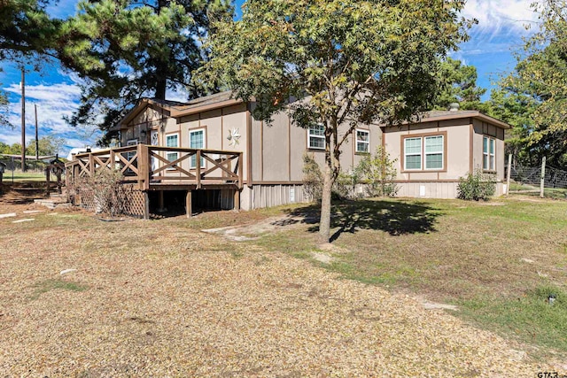 back of property with a wooden deck