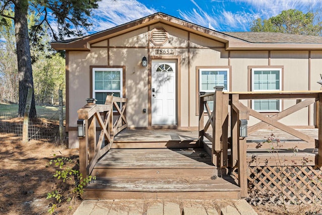 view of front of property with a deck