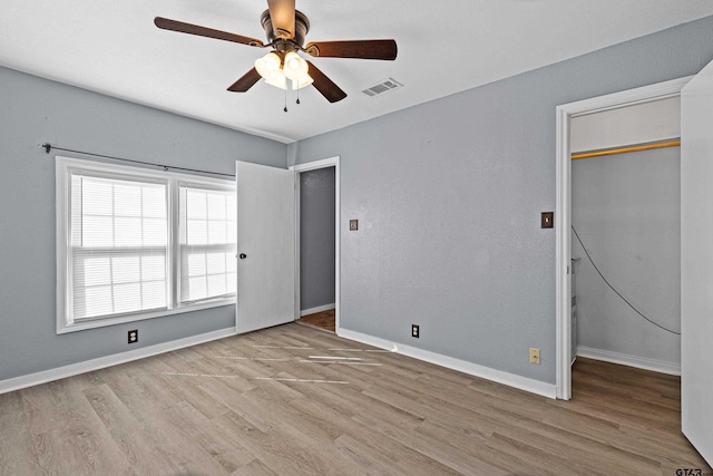 unfurnished bedroom with a closet, ceiling fan, and light hardwood / wood-style flooring