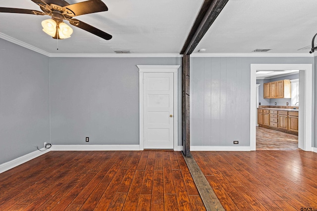 spare room featuring hardwood / wood-style flooring and crown molding