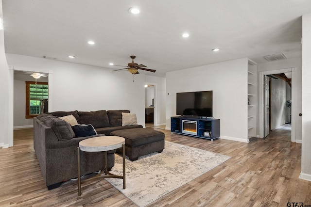 living room with recessed lighting, ceiling fan, visible vents, and wood finished floors