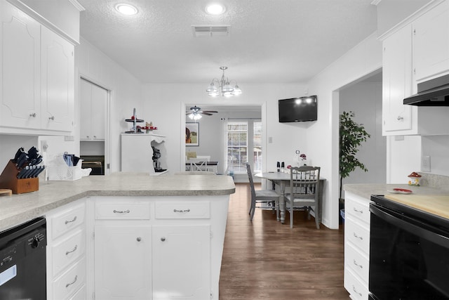 kitchen featuring hanging light fixtures, white cabinets, black dishwasher, stove, and ceiling fan with notable chandelier