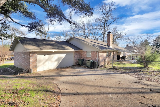 view of side of property with a garage