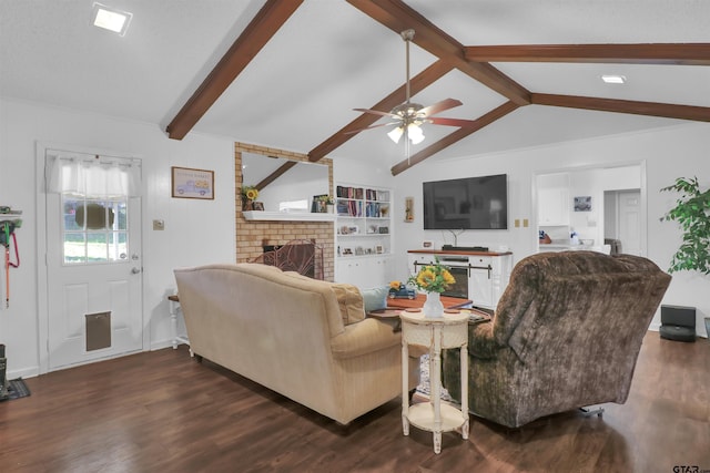 living room with ceiling fan, dark hardwood / wood-style flooring, vaulted ceiling with beams, and a fireplace