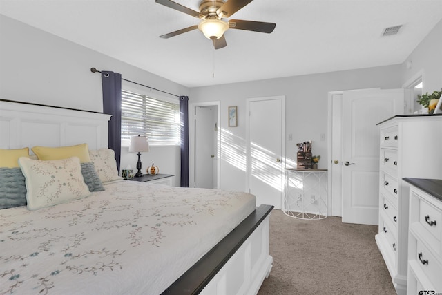 bedroom with dark colored carpet and ceiling fan