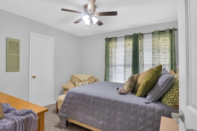 bedroom with ceiling fan and carpet