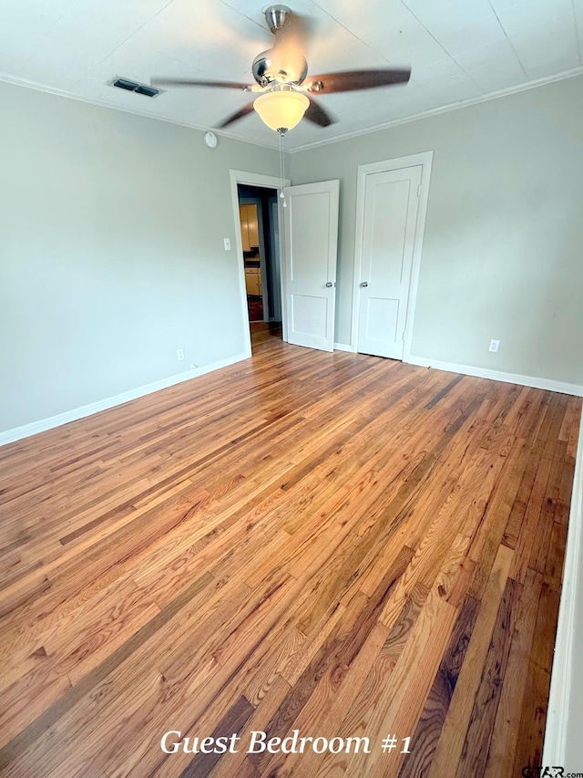 902 W 9th St, Tyler, TX 75701 - unfurnished room with hardwood / wood-style floors, a ceiling fan, baseboards, and crown molding