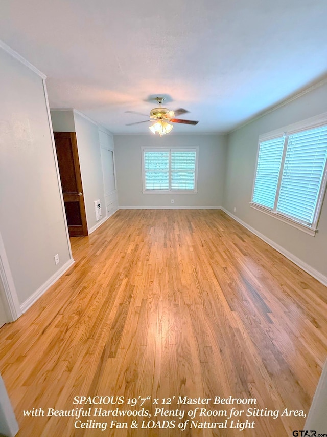 902 W 9th St, Tyler, TX 75701 - empty room with a ceiling fan, light wood-type flooring, baseboards, and crown molding