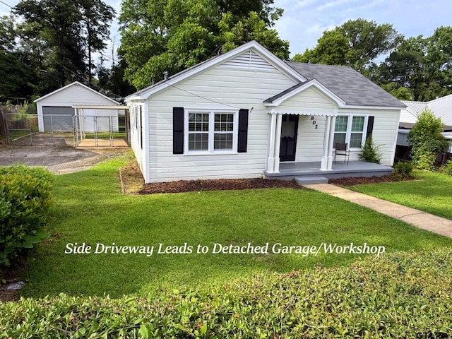 902 W 9th St, Tyler, TX 75701 - bungalow-style house with a porch and a garage