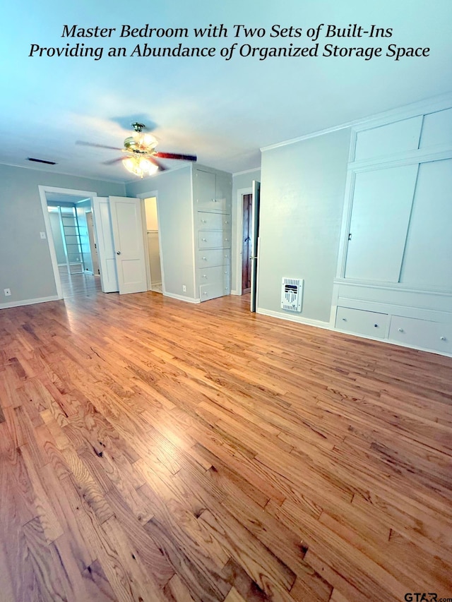 902 W 9th St, Tyler, TX 75701 - spare room with light wood-style floors, heating unit, baseboards, and a ceiling fan