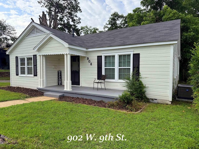 902 W 9th St, Tyler, TX 75701 - view of front of house featuring covered porch, central AC, and a front lawn