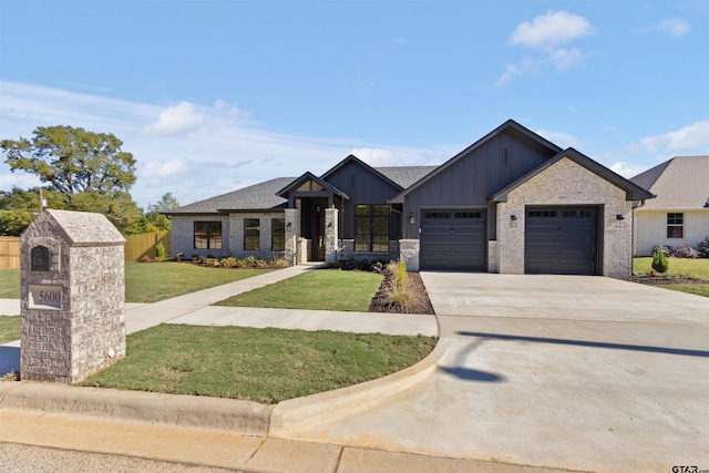 view of front facade with a front yard and a garage